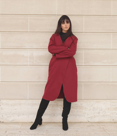 Woman in red coat and black boots