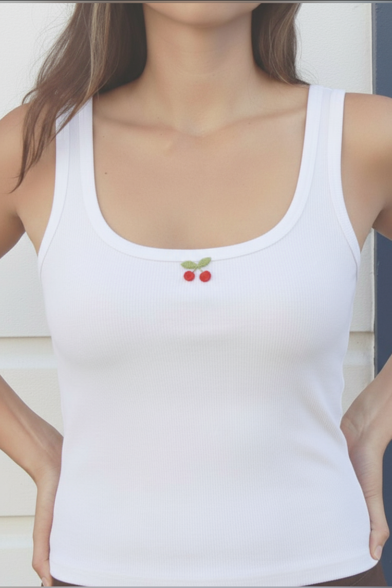 close up white tank top with red cherries