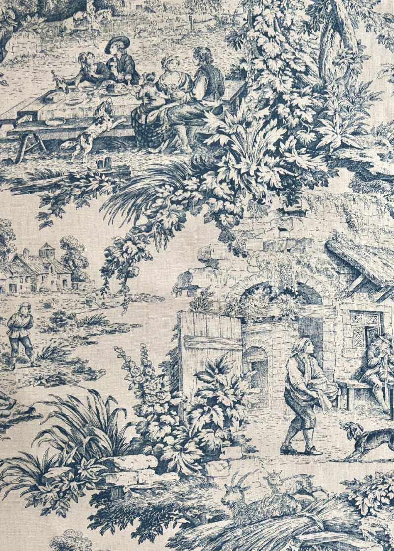 Vintage-style toile fabric pattern with pastoral scenes and people in a garden.