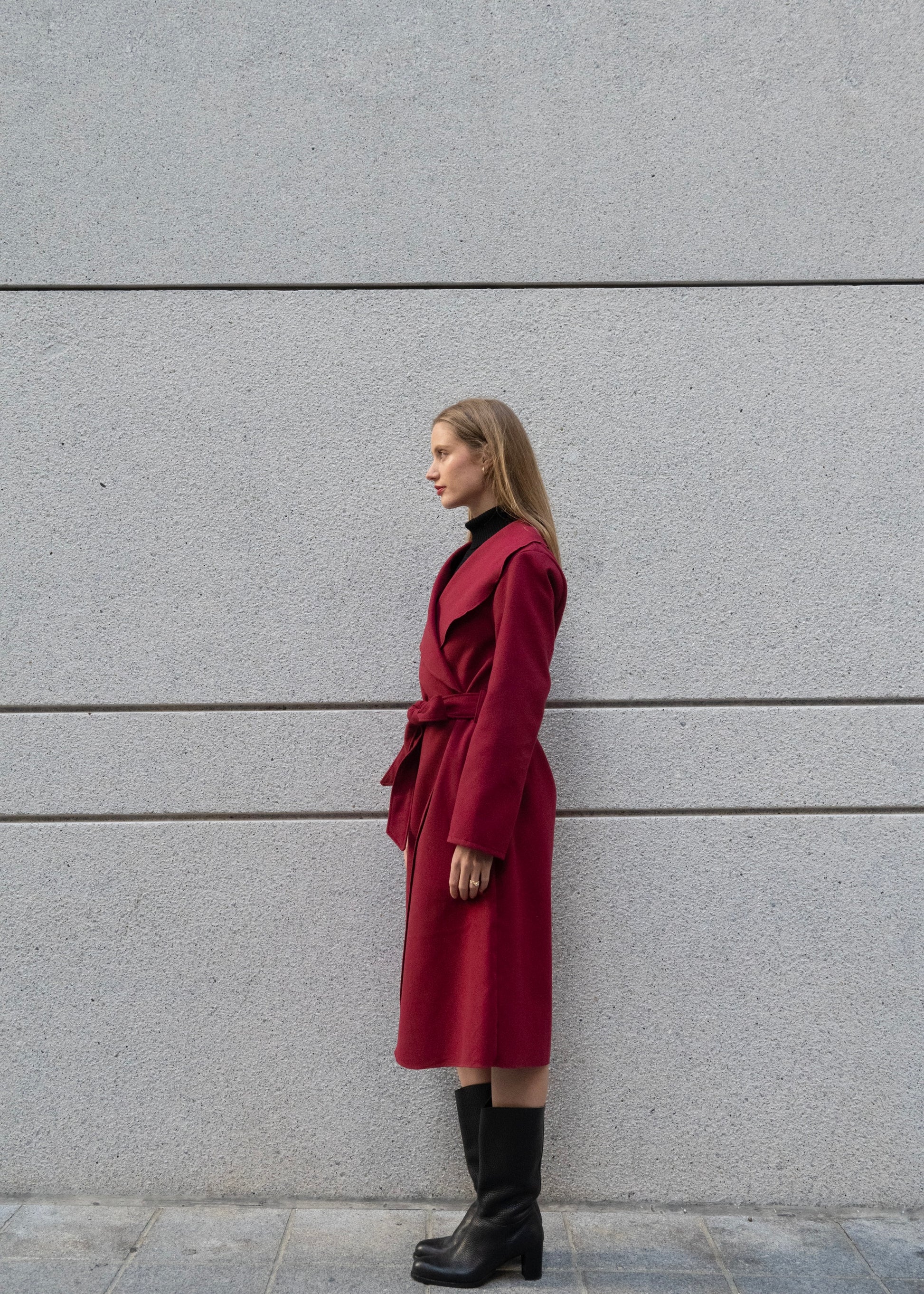 Side view of women’s wool blend wrap coat in Vino, styled over sweater