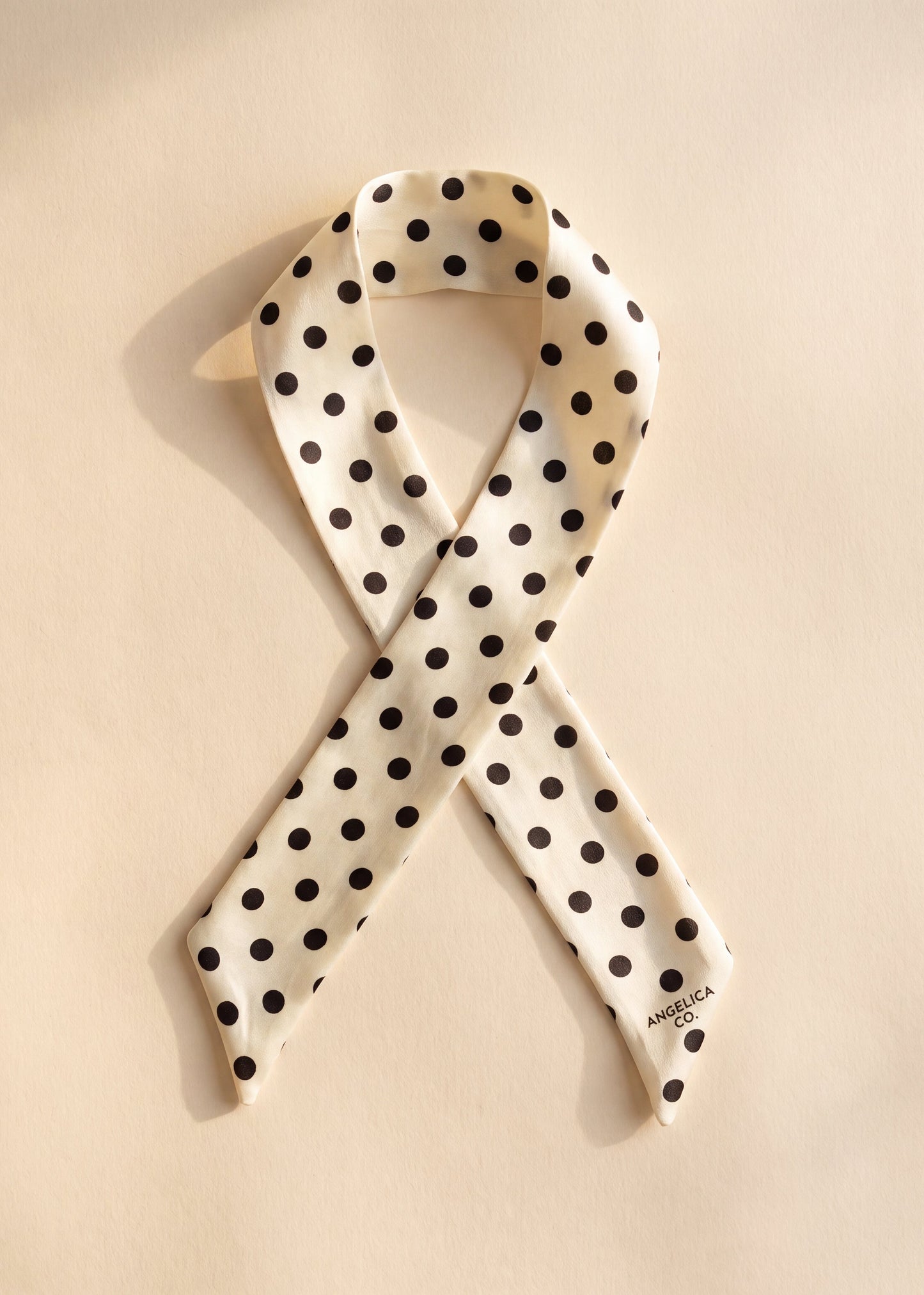 cream silk scarf with black polka dots