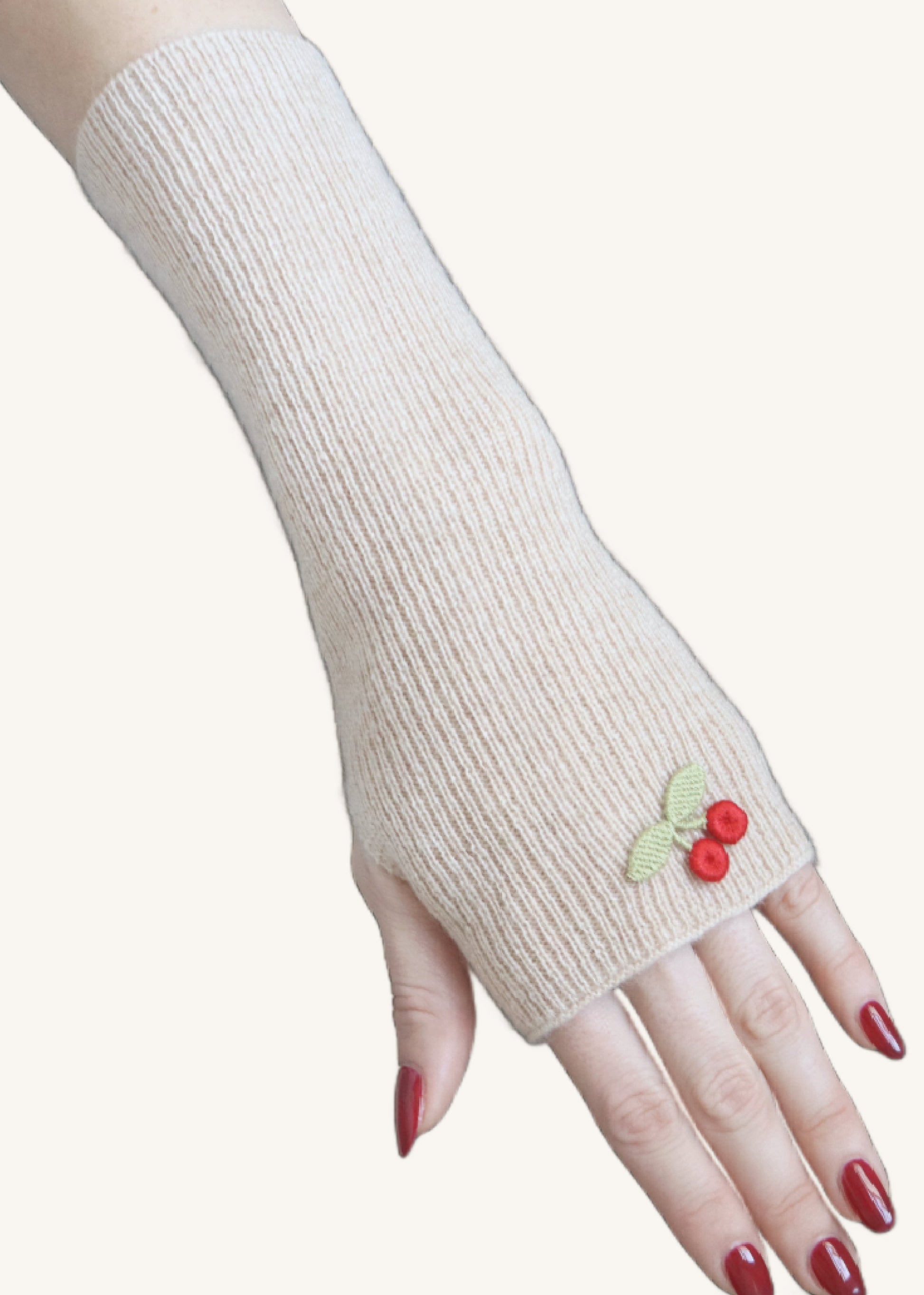 White fingerless glove with cherry design on a white background