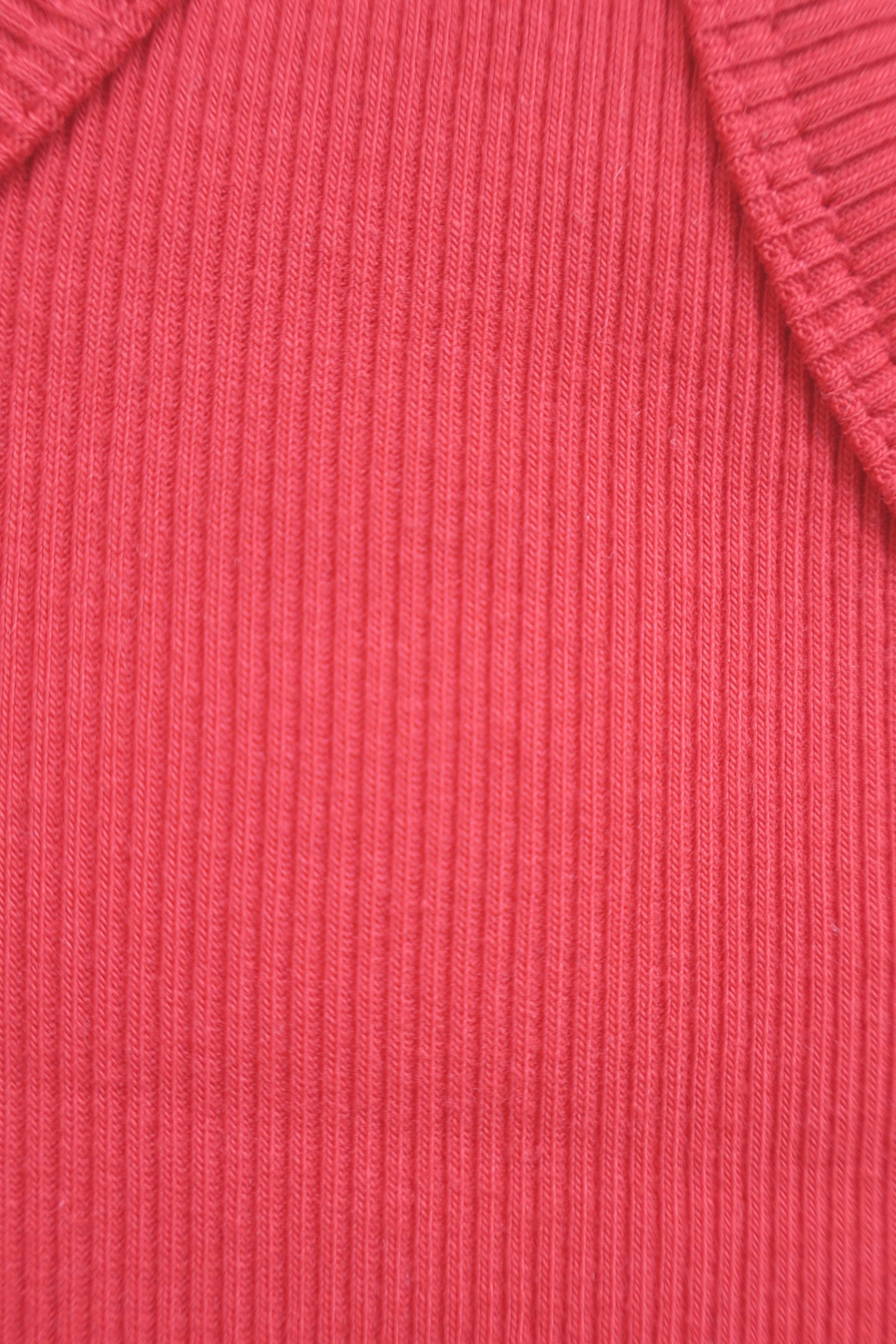 Close-up of a red ribbed fabric texture