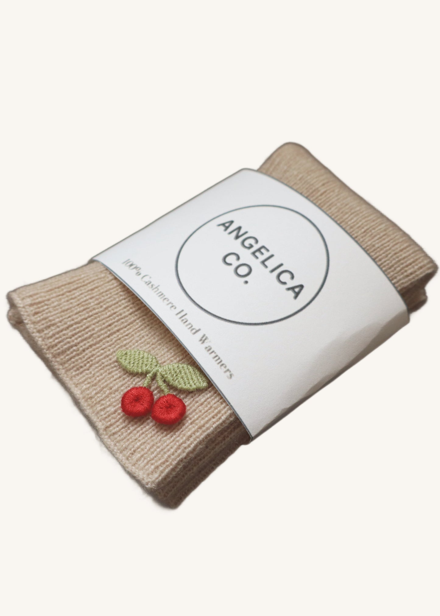 Knitted product with a label reading 'Angelica Co.' on a white background