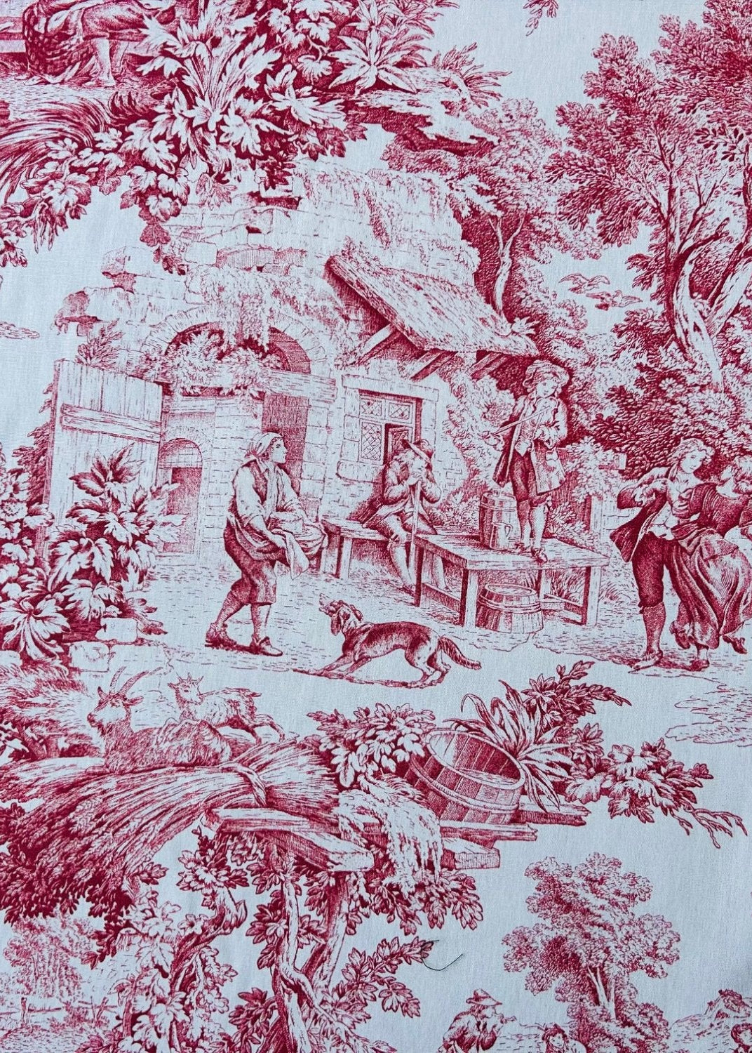 Vintage-style toile fabric with red and white pattern of people and nature.